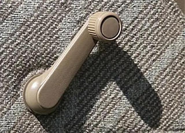 A classic manual car window crank – Once an essential part of every car interior before the age of power windows